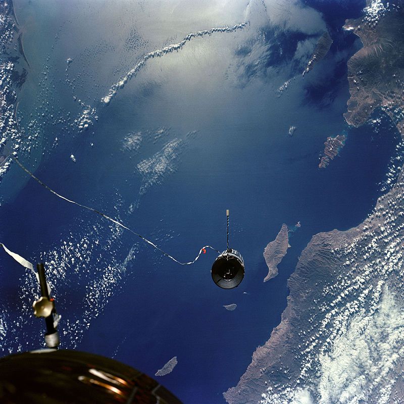 Agena Target Vehicle seen by Gemini 11 backdropped by Earth