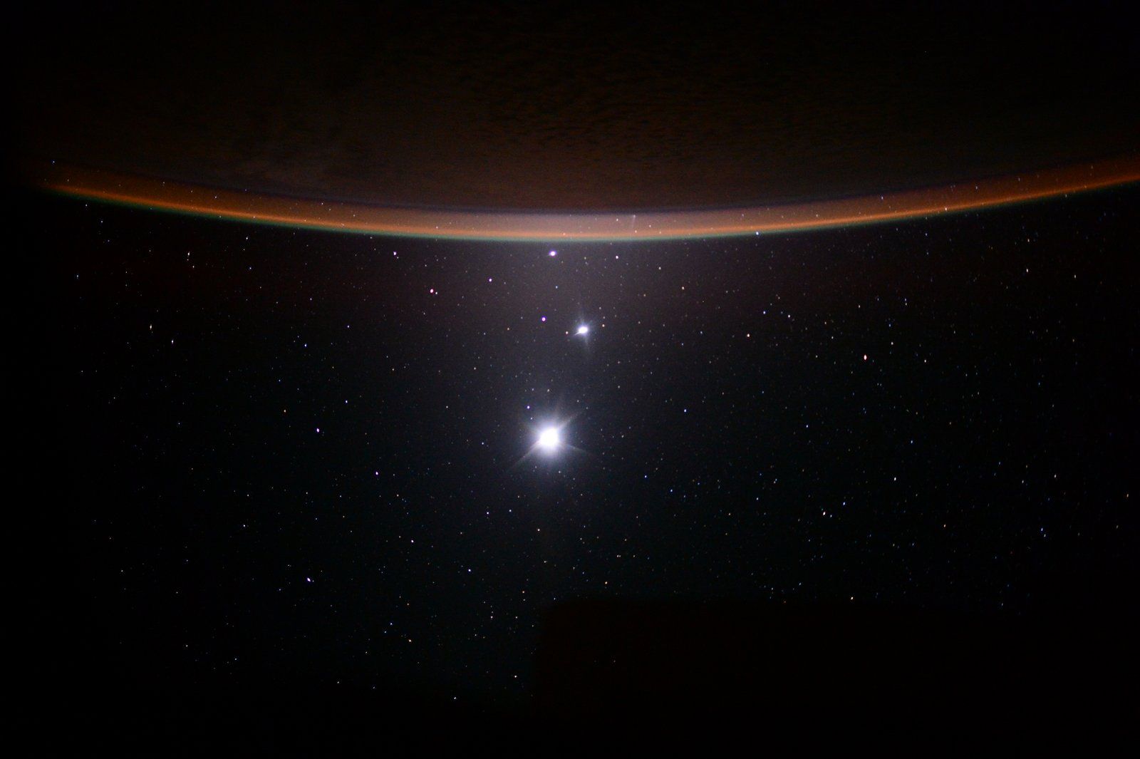 Jupiter, Venus, and the Moon below Earth from the ISS
